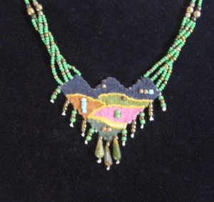 Needle woven pendant with jade beads